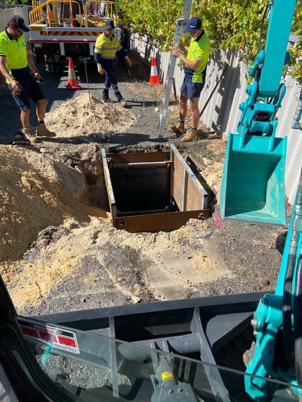 sewer junction Box - Men working